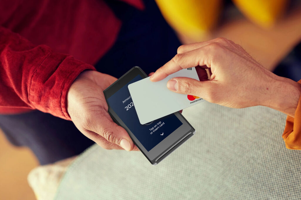 Merchant services Ireland comparison showing business owner evaluating payment options